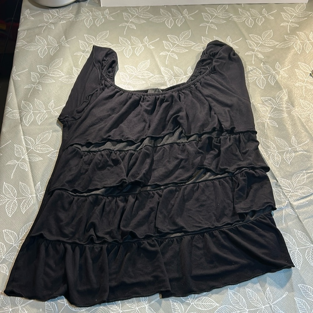 Ladies Sleeveless Ruffled Shirt.